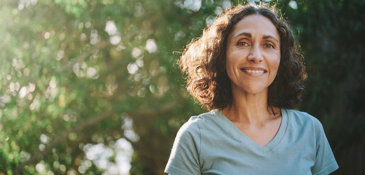 happy woman in the woodlands after receiving testosterone therapy