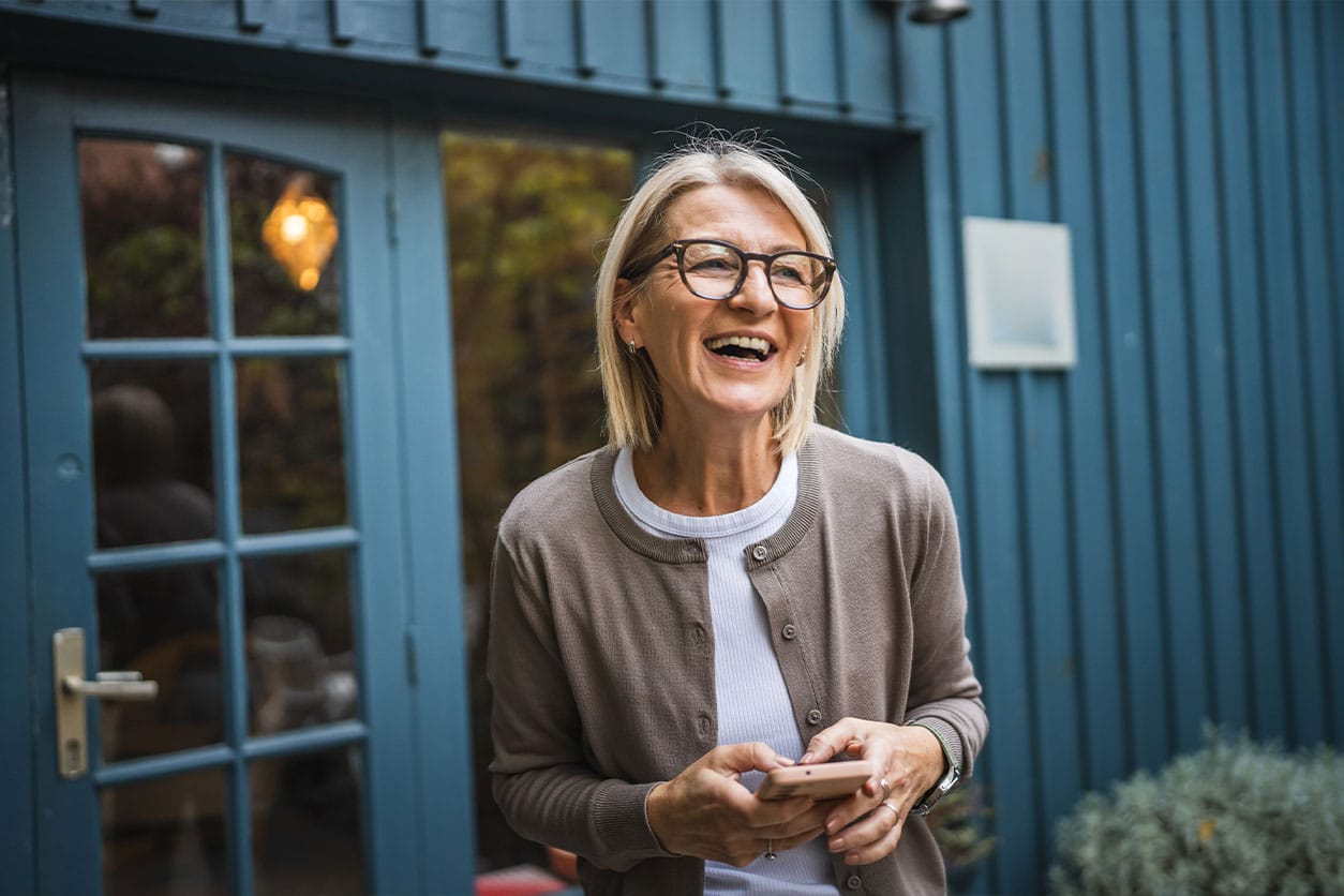older woman smiling after starting hormone therapy in The Woodlands, TX